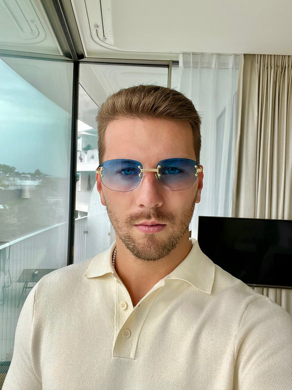 Man wearing sky-blue vintage style sunglasses Emils Jewellery Online shop