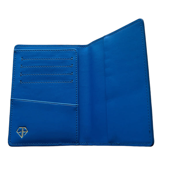 Portefeuille / porte-passeport en cuir bleu gaufré